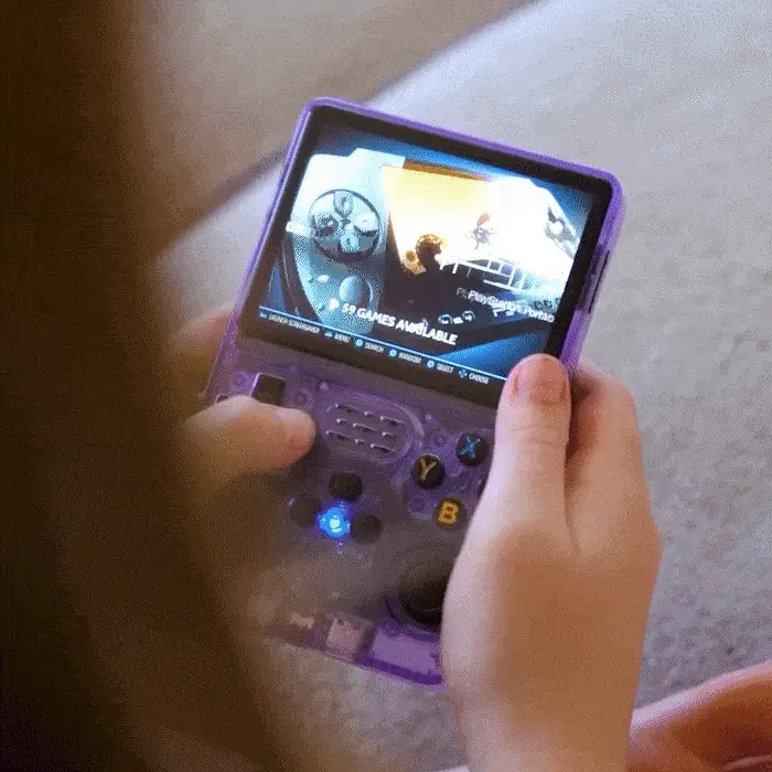 Kid playing with R36S handheld console